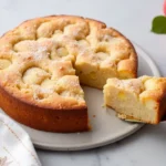 French Apple Cake on a Table with Fresh Apples